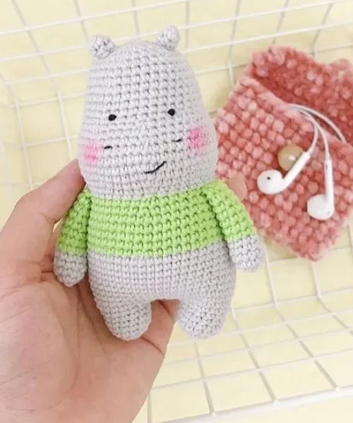 How to Crochet a Hippo Amigurumi for Your Baby, the finished crochet build, photographed on a plain surface