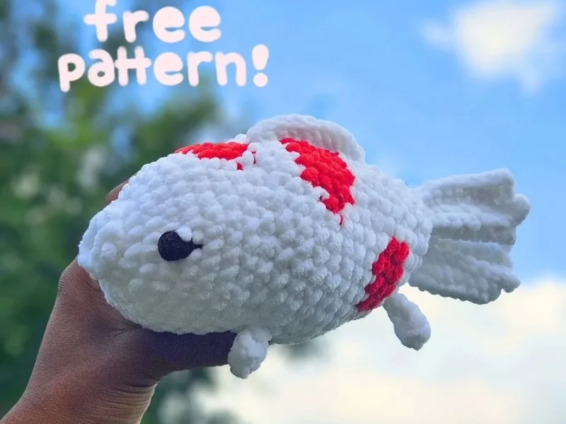 Free Crochet Koi Fish Amigurumi Pattern for Beginners, the finished crochet build, photographed on a plain surface