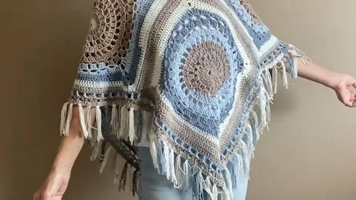Boho puff-stitch poncho built from four crochet squares