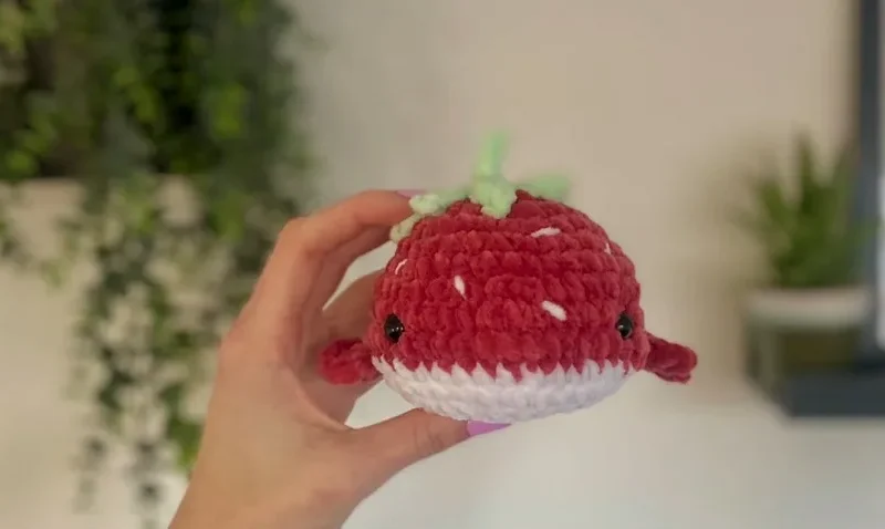 Crochet a strawberry whale plushie with leaf crown