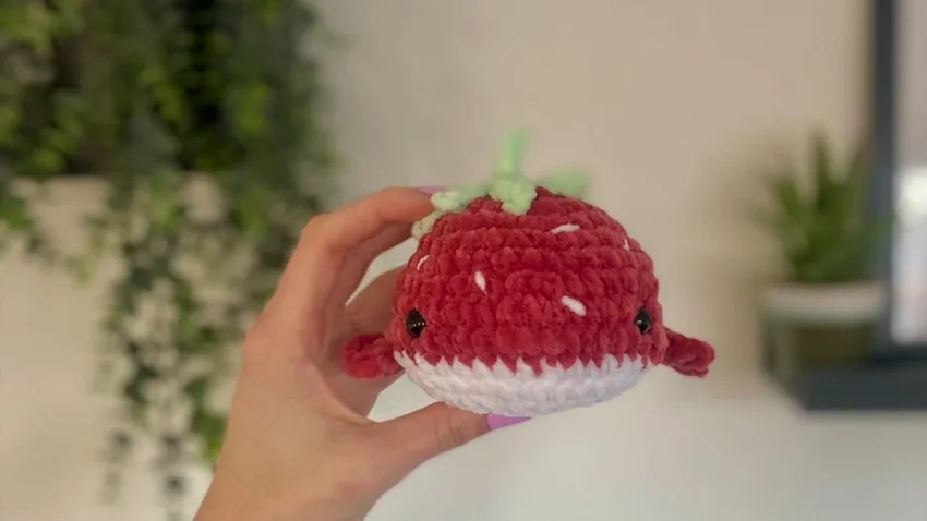 Crochet a strawberry whale plushie with leaf crown