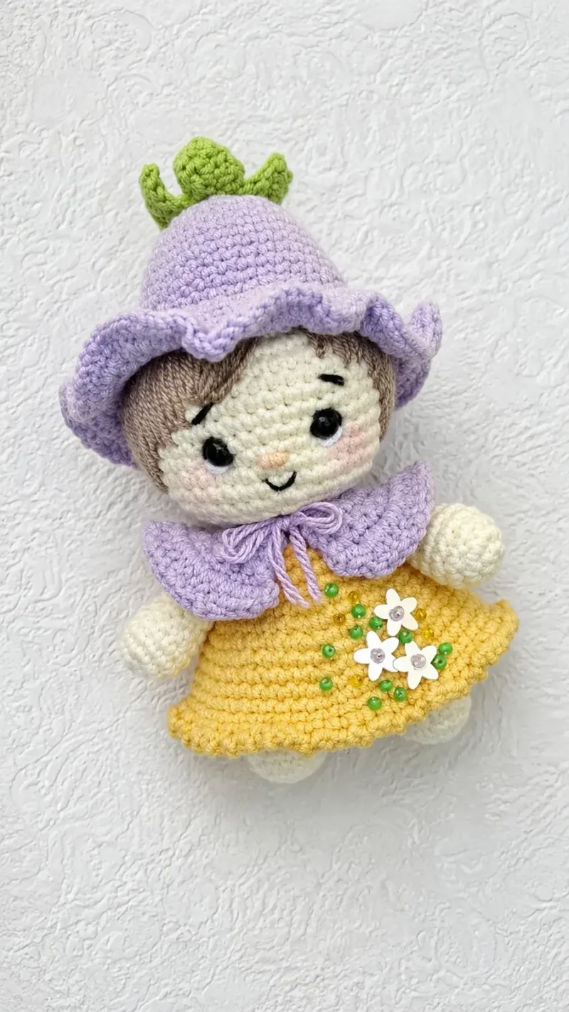 Little gnome girl doll amigurumi with a floral cap — photo 2