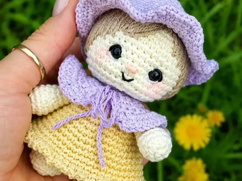 Little gnome girl doll amigurumi with a floral cap